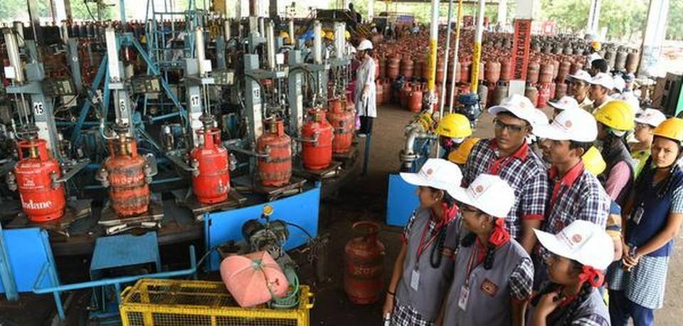 How it is done: School students being taken on a tour through the LPG bottling plant at Mattapparai in Dindigul district on Thursday.  